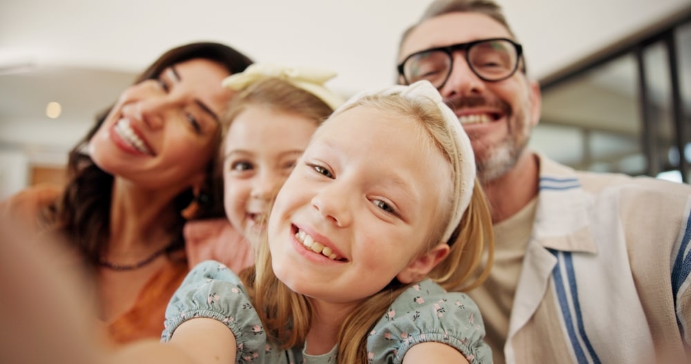family smiling on way to Children’s Dentist in Edmonton